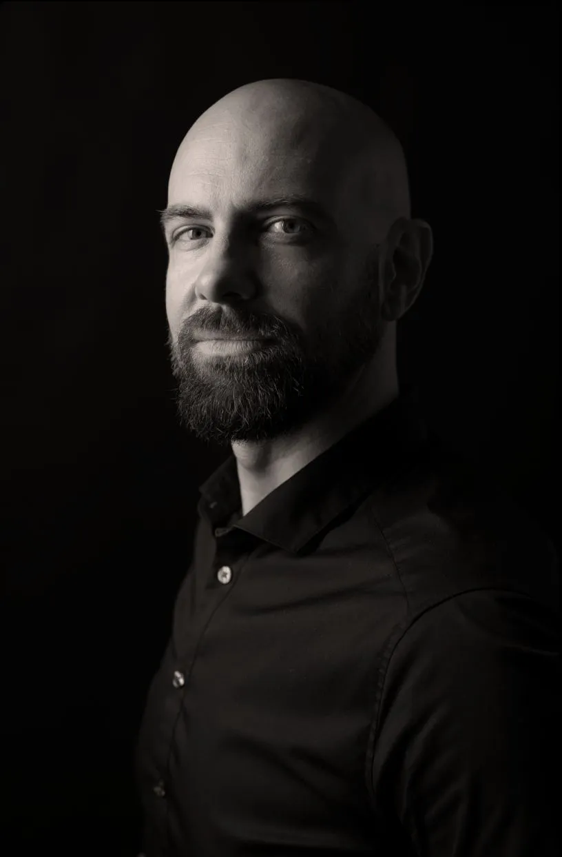 Portrait of Alex Glasneck in a dark shirt