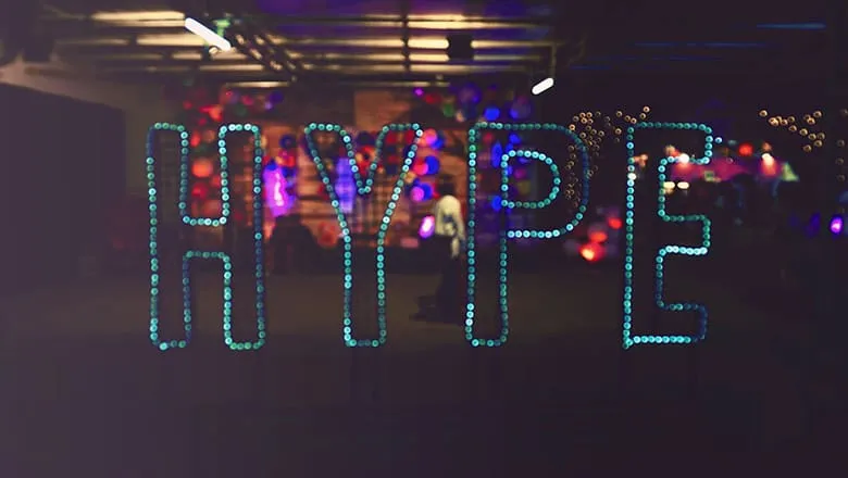 The word HYPE in light bulbs at a night event